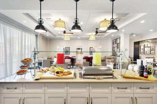 a breakfast bar with food on a counter at Homewood Suites by Hilton Providence Downtown in Providence