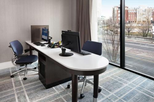 an office with a desk with a computer and two chairs at Homewood Suites by Hilton Providence Downtown in Providence