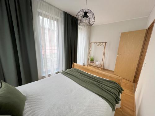 Krevet ili kreveti u jedinici u objektu Cozy Apartment near City Centre