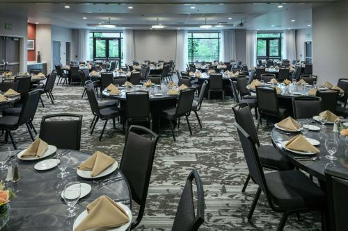 a large banquet hall with tables and chairs at Hilton Garden Inn Wenatchee, Wa in Wenatchee