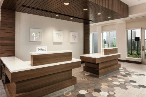 a salon with two counters in a room with windows at Hilton Garden Inn Sacramento Airport Natomas in Sacramento