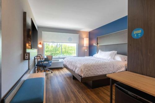 a hotel room with a bed and a desk and a window at Tru By Hilton Seneca Clemson Sc in Seneca