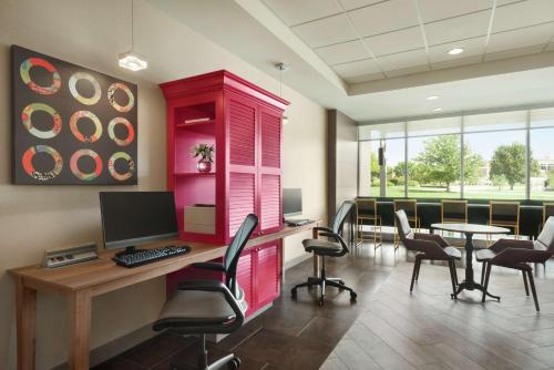 an office with a desk with a computer and chairs at Home2 Suites By Hilton Overland Park, Ks in Overland Park