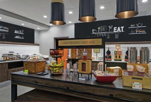 a store with a counter with food on it at Hampton Inn Weslaco in Weslaco