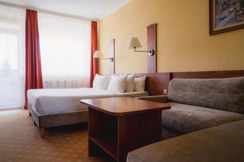 Кровать или кровати в номере Belenus Thermalhotel superior