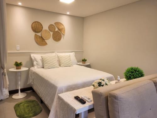 Ένα ή περισσότερα κρεβάτια σε δωμάτιο στο Residence Farol - Loft 210