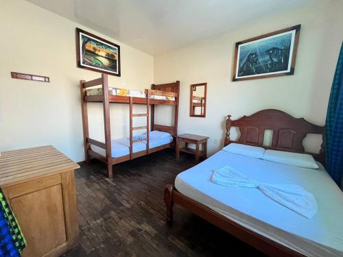 a bedroom with two beds and a bunk bed at Hostel Manaus in Manaus