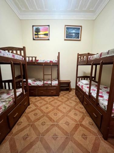 a room with three bunk beds in a room at Hostel Manaus in Manaus