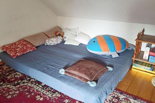 a bed with pillows on it in a room at Trzemcha in Tuchów