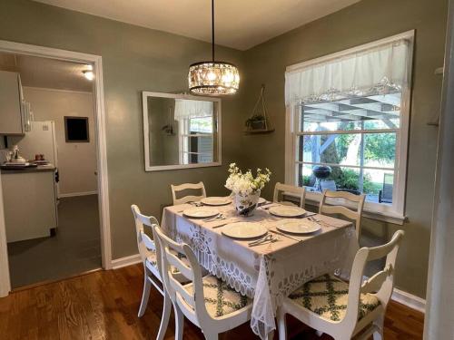 a dining room with a table and chairs and a kitchen at The Bourbon & Horse Country EpiCenter in Frankfort