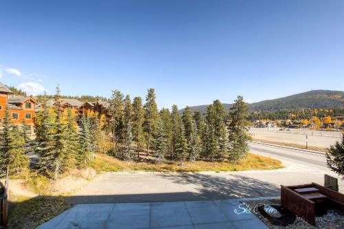 an empty driveway with trees on the side of a road at A Perfect Location Walk to EVERYTHING Onsite Hot Tubs Grill And Pool SH52 in Breckenridge