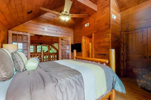 a bedroom with a bed in a cabin at The Lodge at Wears Valley in Sevierville