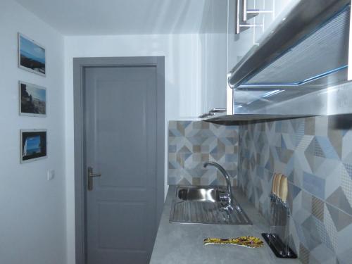 a kitchen with a sink and a counter top at Casa Mona in Corralejo