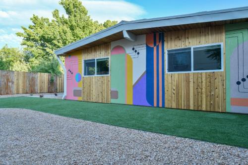 a building with a colorful mural on the side of it at Moab Inn Towner #4 - Heart of Downtown in Moab