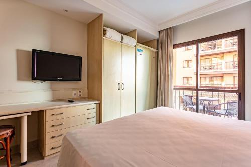 Postel nebo postele na pokoji v ubytování Estúdios Modernos em Resort pé na areia - Jurerê Beach Village JBVJR