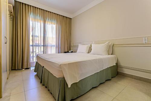 Postel nebo postele na pokoji v ubytování Estúdios Modernos em Resort pé na areia - Jurerê Beach Village JBVJR