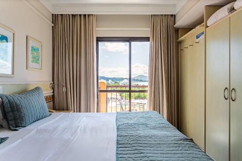 Postel nebo postele na pokoji v ubytování Estúdios Modernos em Resort pé na areia - Jurerê Beach Village JBVJR