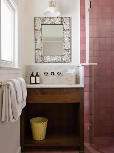 a bathroom with a sink and a mirror at Farmhouse Paso in Paso Robles