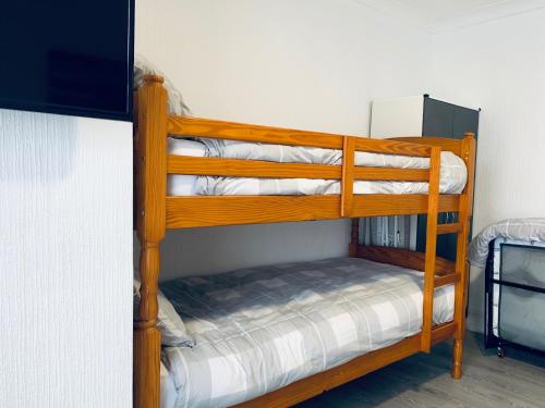 a couple of bunk beds in a room at The WhiteHouse Holiday Apartments in Blackpool