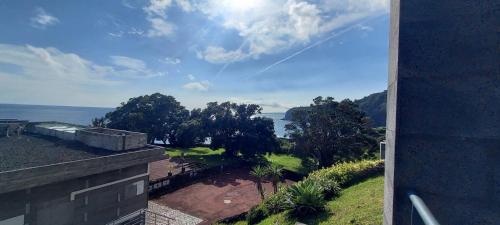 a view of the ocean from a house at Vivenda Moura, Caloura in Caloura