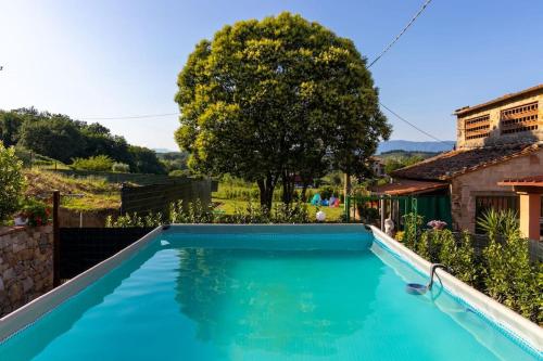 a swimming pool in front of a house at Casale Toscano [Piscina Wi-Fi] in Capannori