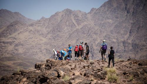a group of people standing on top of a mountain at Kasbah Assafar in Kalaat MGouna