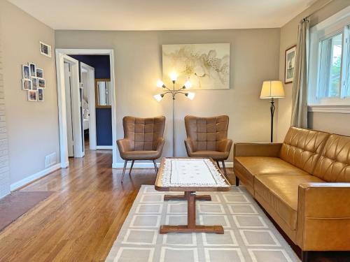 a living room with a couch and two chairs at Entire Private 3 Bedrooms 1 Bathroom Single House with Fenced Garden in Arlington