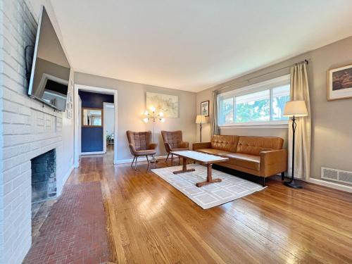 a living room with a couch and a fireplace at Entire Private 3 Bedrooms 1 Bathroom Single House with Fenced Garden in Arlington