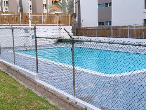 The swimming pool at or close to Newly Renovated Modern Apartment in San Juan Center with Backup Electricity and Gated Security 602