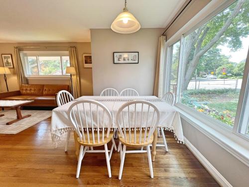 a dining room with a table and chairs and a window at Entire Private 3 Bedrooms 1 Bathroom Single House with Fenced Garden in Arlington