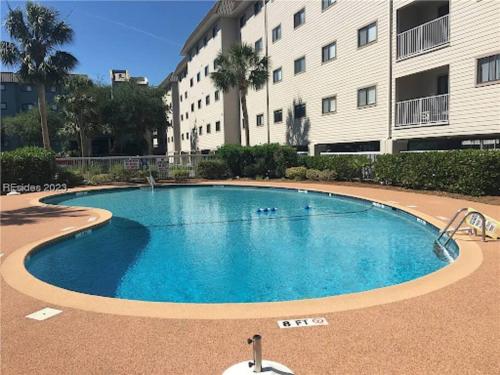 a large swimming pool in front of a building at Seaside Sanctuary Condo Villa - Private Beach Access, 3 Pools in Hilton Head Island
