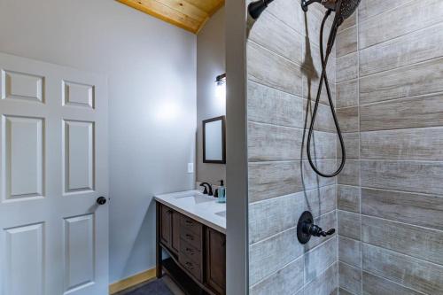 a bathroom with a shower and a sink at Cozy cabin in Ellijay, near Blue Ridge ! in Ellijay