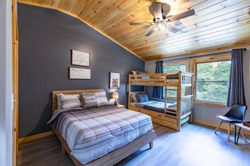 a bedroom with a bed and a wooden ceiling at Cozy cabin in Ellijay, near Blue Ridge ! in Ellijay