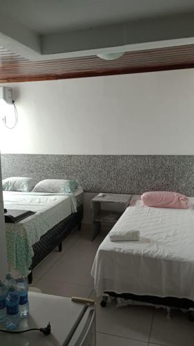 Postel nebo postele na pokoji v ubytování Pousada Beira Litoral