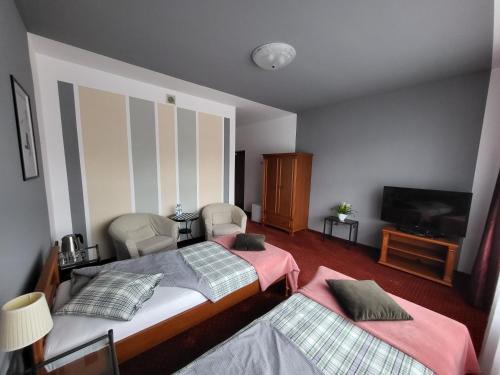Posteľ alebo postele v izbe v ubytovaní Apartamenty Amadeus