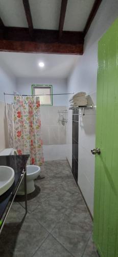 a bathroom with a toilet and a sink at Korp View House in Wang Nam Khieo