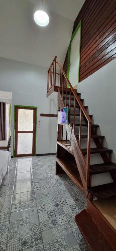 a room with a wooden staircase in a house at Korp View House in Wang Nam Khieo