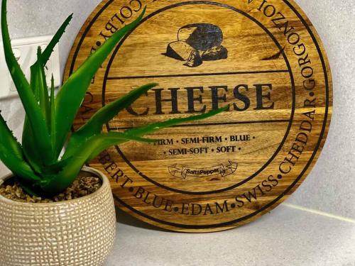 a wooden wine barrel with a plant in a vase at LAHOOL GUEST HOUSE JUST A CREEKSIDE STROLL TO TOWN in Stanthorpe