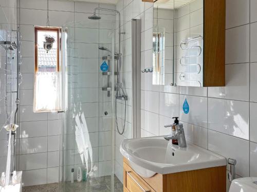 a bathroom with a sink and a shower and a sink at 5 person holiday home in VISBY-By Traum in Visby