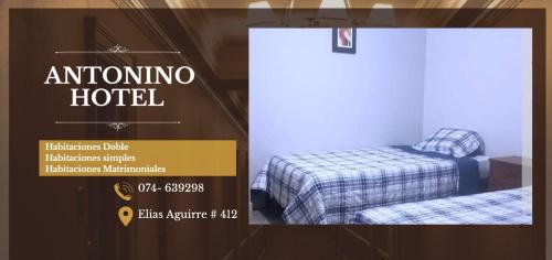 póster de un hotel omino con 2 camas en ANTONINO HOTEL, en Chiclayo