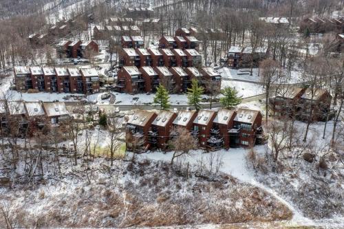 an aerial view of a resort in the snow at Cozy 2BR condo w/ valley views in Vernon Township