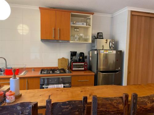 Η κουζίνα ή μικρή κουζίνα στο Departamento Condominio Parque del Volcan