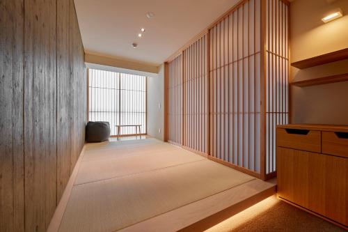 Ένα ή περισσότερα κρεβάτια σε δωμάτιο στο THE HOTELS HAKATA Harushige Honkan