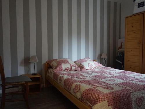 a bedroom with a bed and a chair and a dresser at Appartement cosy 4 pers avec balcon sud, proche centre et pistes – Autrans-Méaudre en Vercors - FR-1-737-9 in Méaudre