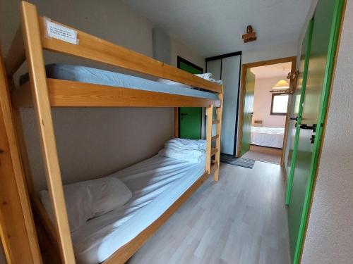 a bunk bed room with two bunk beds in it at Appartement Autrans, 2 pièces, 4 personnes - FR-1-737-19 in Autrans