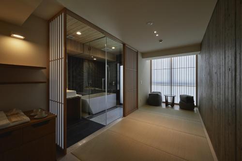 Ένα ή περισσότερα κρεβάτια σε δωμάτιο στο THE HOTELS HAKATA Harushige Honkan