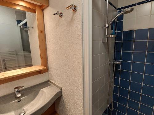 a bathroom with a sink and a shower at Appartement Autrans-Méaudre en Vercors-Autrans, 2 pièces, 4 personnes - FR-1-737-24 in Autrans