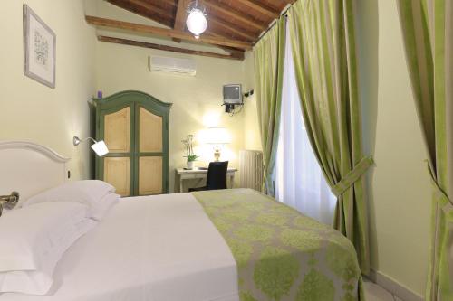 Katil atau katil-katil dalam bilik di Relais Lavagnini Florence
