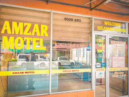 a store front window of a motor vehicle dealership at Amzar Motel Cenang in Pantai Cenang