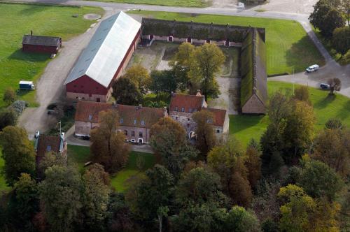 an aerial view of an old house with a building at borgeby Slotts Hotell in Bjärred